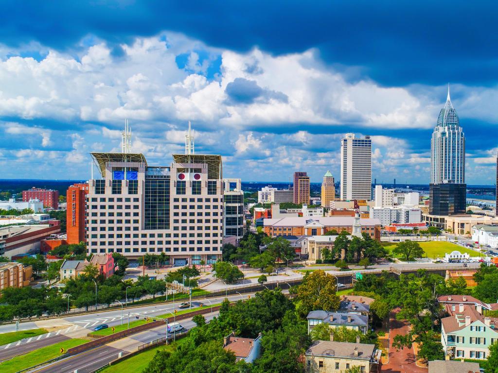 Mobile, Alabama, USA with a drone aerial view of downtown Mobile on a sunny day.