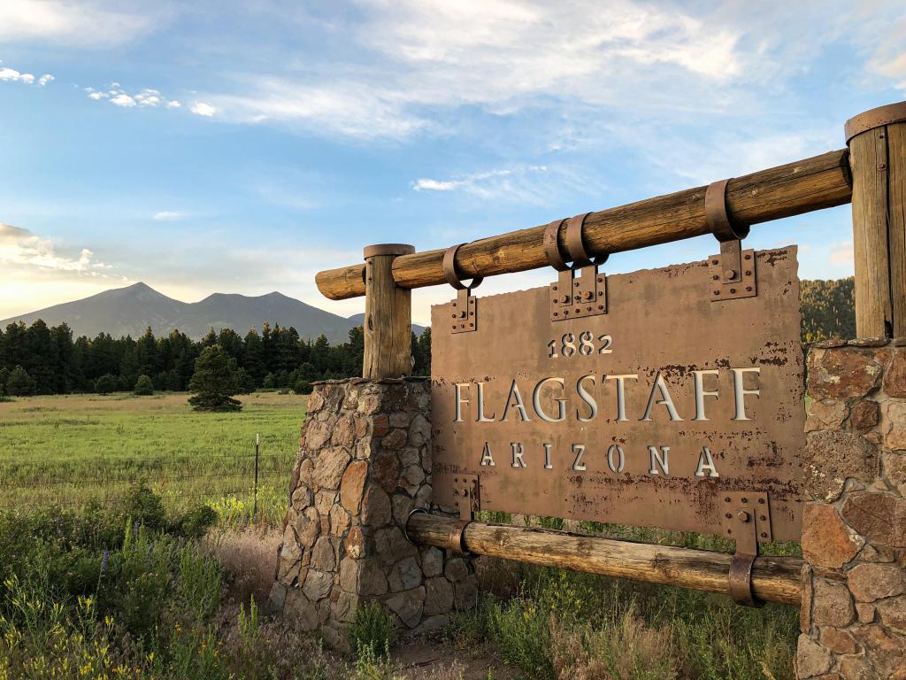 Rustic sign at the town limits of Flagstaff, Arizona