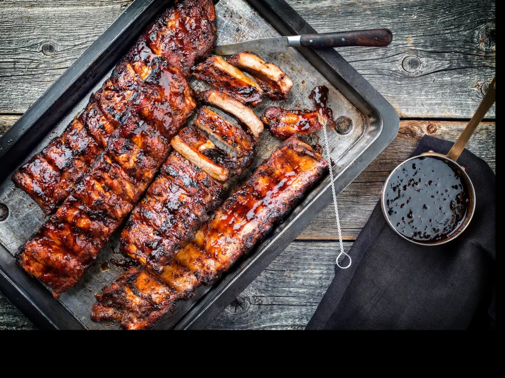 St Louis BBQ style racks of ribs with thick sauce