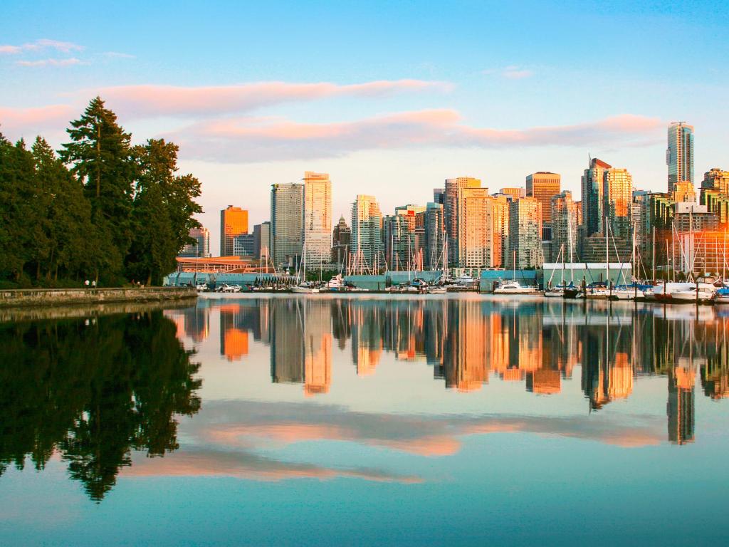 Vancouver skyline at dusk reflected in a lake surface