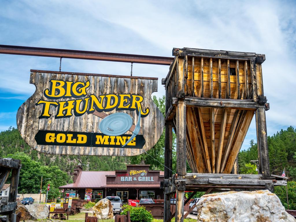 Big Thunder Gold Mine entrance sign on a cloudy day