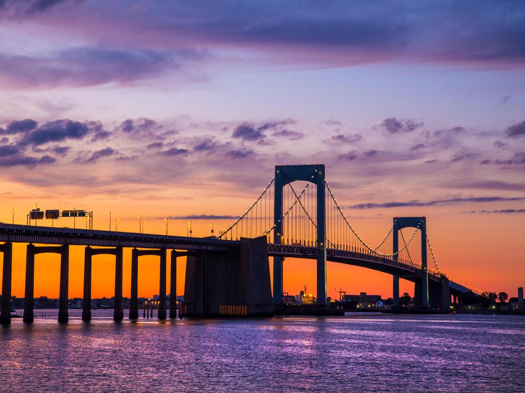 Purple and orange sunset over Long Island Sound and Throgs Neck Bridge