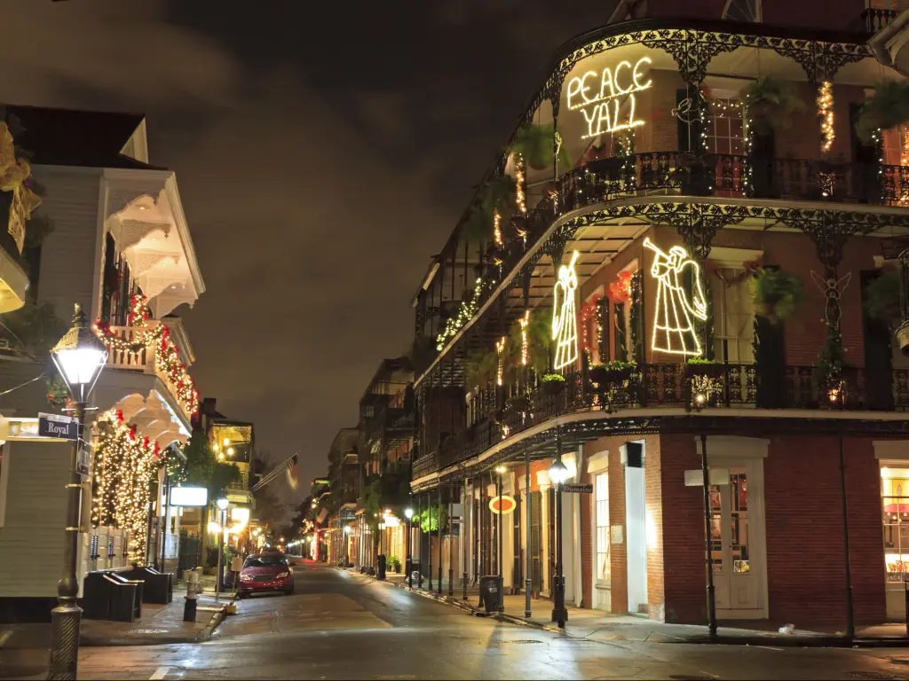 Christmas decorations light up buildings in New Orleans' French Quarter at night