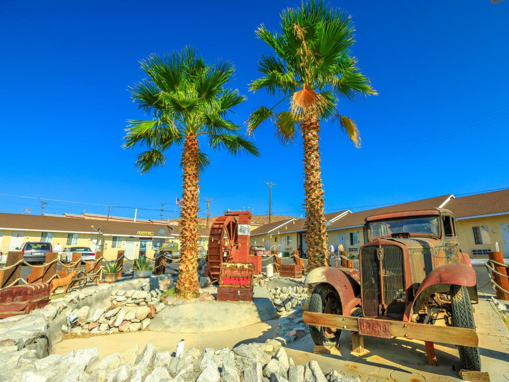 Vintage old car at retro Route 66 Motel in Barstow, California in the summer