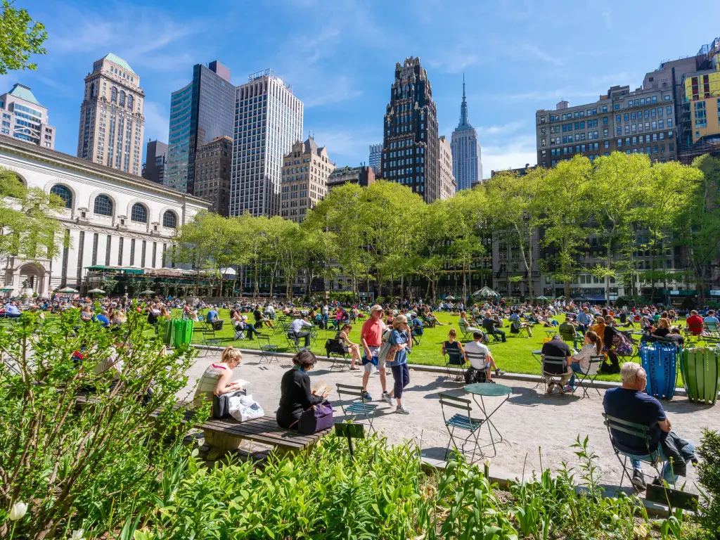 People sitting in the sunshine in Bryant Park, New York