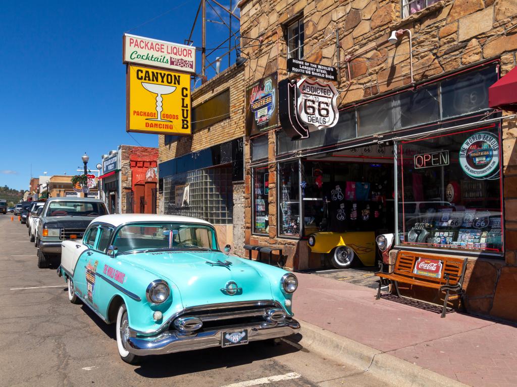 Vintage car parked outside a Route 66 themed store in Williams, Arizona, on a sunny day