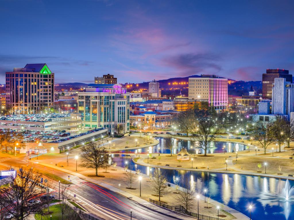 Huntsville, Alabama, USA park and downtown cityscape at twilight.