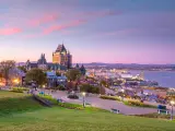 Quebec City, Canada taken as a panoramic view of Quebec City skyline with Saint Lawrence river at sunset.
