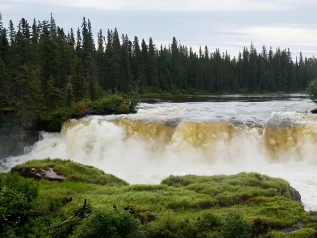Crashing waterfalls and lush forests at Thompson Manitoba Waterfalls
