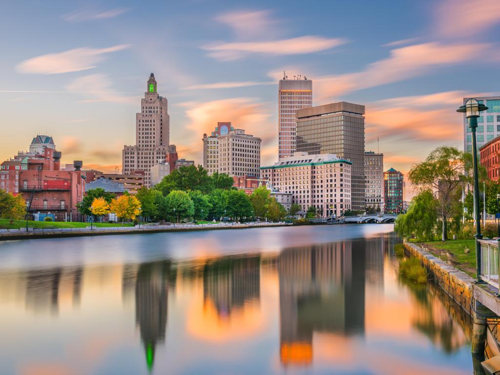 Providence, Rhode Island, USA downtown cityscape viewed from above the Providence River taken at early sunset.