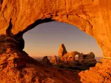 Turret Arch through the North Window at sunrise in Arches National Park near Moab, Utah