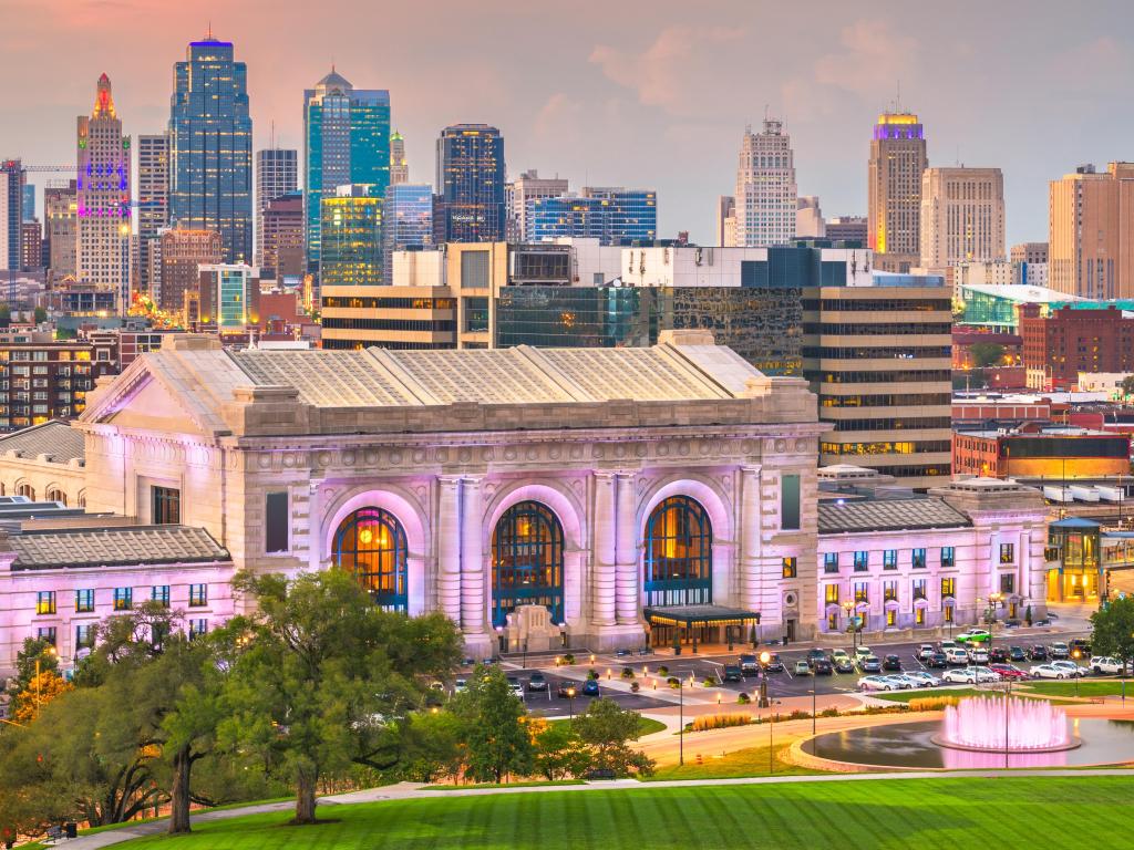 Kansas City, Missouri, USA downtown skyline panorama at dusk.