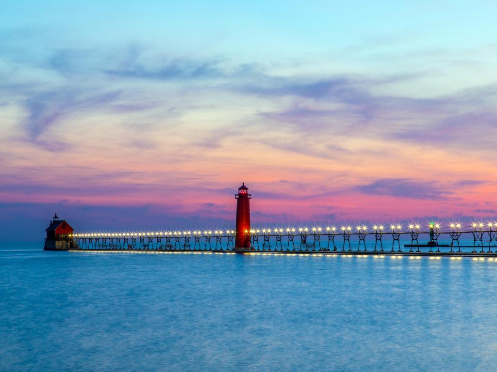 View of the Grand Haven South Pierhead Inner and Outer Lighthouses at sunset; Grand Haven State Park, Lake Michigan